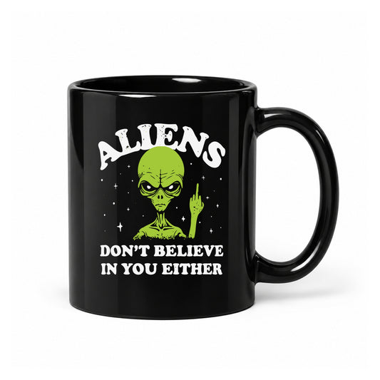 11-ounce glossy black ceramic mug with the Aliens Don't Believe in You Either design, front view.