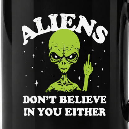 Close-up of the original alien artwork printed on the 11-ounce black ceramic mug.