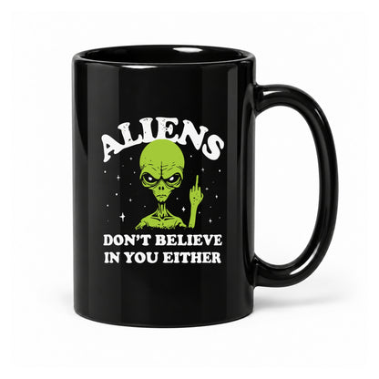 15-ounce glossy black ceramic mug with the Aliens Don't Believe in You Either design, front view.